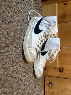 Nike White High-Top Sneakers with Black Swoosh Accent